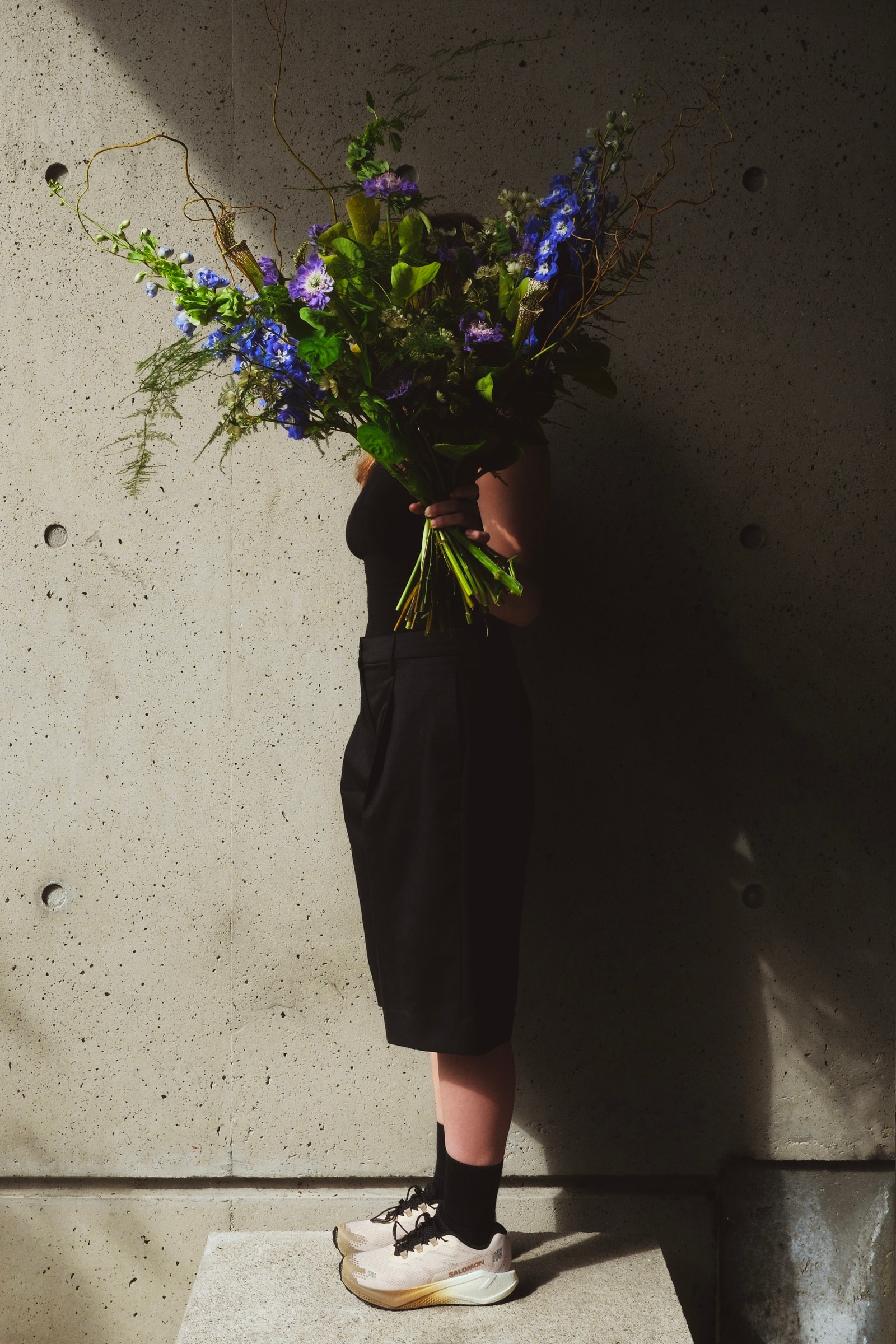 Fernanda Navarro among flowers in the Salomon In Bloom lookbook