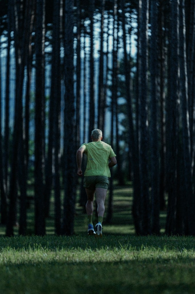 Diadora Own the Track lookbook — runner on a forest trail in Vancouver running apparel