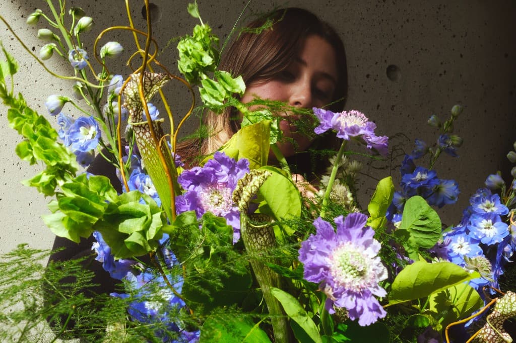 Fernanda Navarro of Studio Vizcaino 361 surrounded by flowers